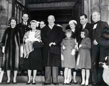 January 20, 1957 - Dwight D. Eisenhower and Richard Nixon leaving the National Presbyterian Church following a pre-inaugural service. The service took place before the private swearing in ceremony. Shown from L to R are: Barbara Eisenhower, John S.D. Eisenhower, Mamie Eisenhower, President Eisenhower, Tricia Nixon, Pat Nixon, Richard Nixon with Julie Nixon standing in front of him, and Reverend Edward Elson [72-2061-5]