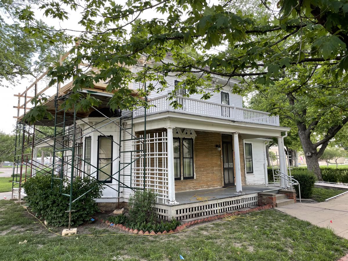Photo showing the scaffolding at the boyhood home during the 2022 preservation project.