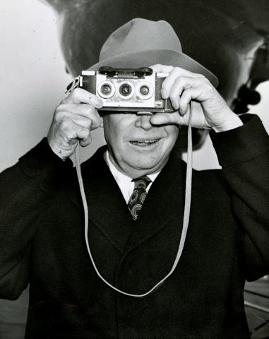 President Eisenhower photographs his photographers, Washington, DC, December 25, 1953. [72-622-2]