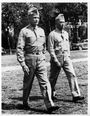 Dwight Eisenhower and unidentified officer walk across lawn at Fort Sam Houston in San Antonio, Texas, 1941 [64-58-1]