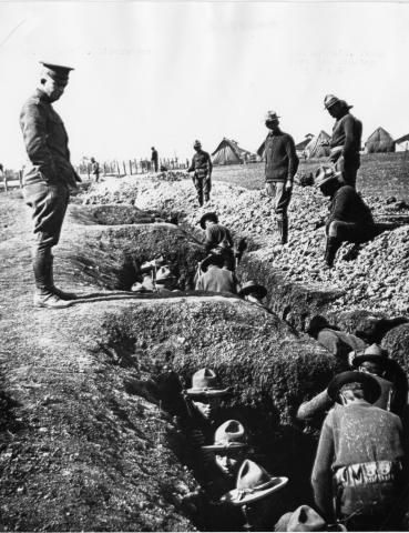Dwight D. Eisenhower inspecting trenches dug by units of the Illinois National Guard while on Mexican border duty in 1916, at Fort Sam Houston, Texas. [65-859-1]