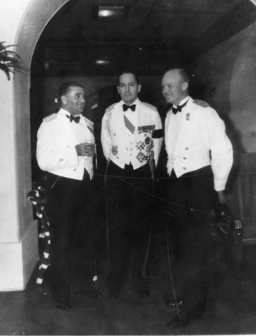 General Douglas MacArthur, Major Dwight D. Eisenhower, and Captain T.J. Davis are shown in formal dress at Malacanang Palace in Manila, The Philippines, 1935 [71-368-1]