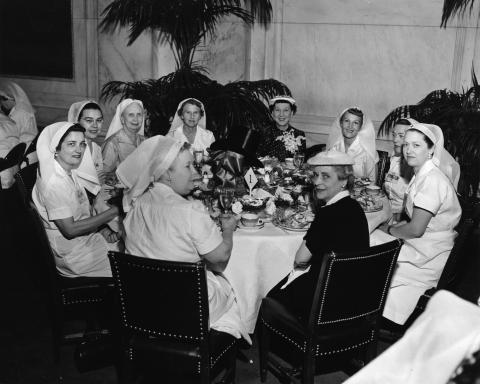 Mamie Eisenhower attends an annual luncheon held by the Senate Ladies Red Cross Unit. April 24, 1956 [72-1707-1]