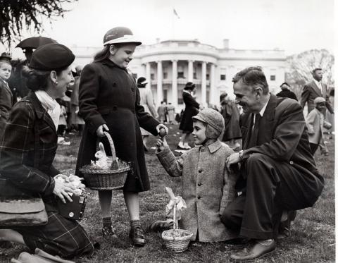 Unidentified family at Easter Egg Rolling festivities on the south lawn of the White House. April 6, 1953 [72-190-16]