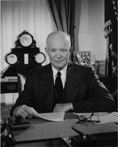 Image of President Eisenhower at his desk in the White House.