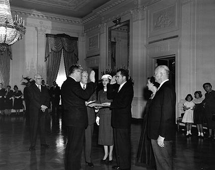 January 20, 1957 - Vice President Richard Nixon being sworn in by Senator William Knowland during the private ceremony held in the East Room of the White House