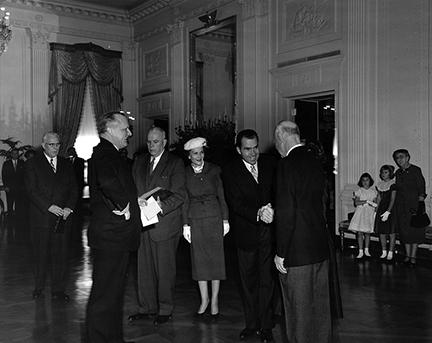 January 20, 1957 - Vice President Nixon shaking hands with Dwight D. Eisenhower during the private ceremony held in the East Room of the White House