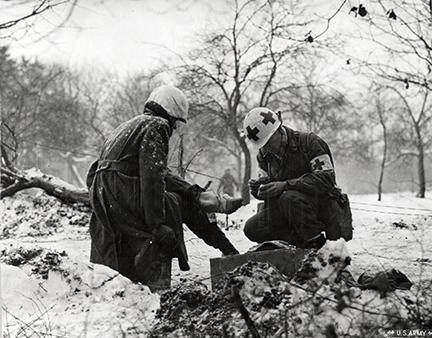 Ardennes-Battle of the Bulge. January 15, 1945 - First aid in the woods near Tittingen, Germany.