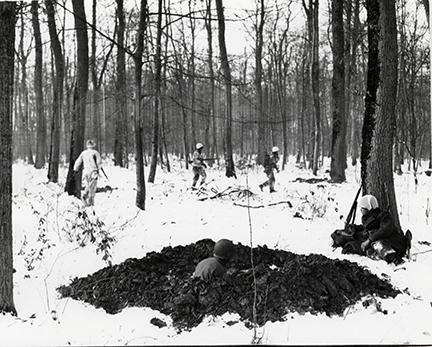 Ardennes-Battle of the Bulge. January 16, 1945 - A patrol of the 94th Division heads into the woods before the Siegfried Line in Nochern, Germany.