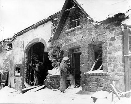 Ardennes-Battle of the Bulge. January 21, 1945 - A house to house search for snipers in Schoppen, Belgium, by men of the 1st Division.