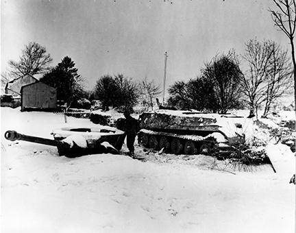 Ardennes-Battle of the Bulge. January 23, 1945 - A Mark VI Tiger tank was rendered useless by tanks of th 6th Armored Division in Moinet, Belgium.