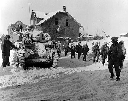 Ardennes-Battle of the Bulge. January 24, 1945 - Parachute infantry move on snow covered ground toward the front to keep up the pressure being applied to the Germans beyond St. Vith, Belgium.