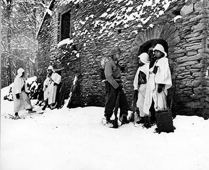 Ardennes-Battle of the Bulge. January 15, 1945 - Rendezvous for two elements of the 84th Division at an abandoned mill near River L'Ourt, Belgium.