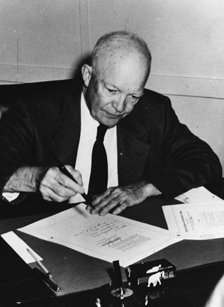 September 9, 1957 - Dwight D. Eisenhower signs the Civil Rights Act of 1957 (H.R. 6127) in his office at the naval base in Newport, Rhode Island