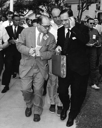 September 14, 1957 - Arkansas Governor Orval E. Faubus besieged by newsmen following his two hour conference with DDE at the naval base in Newport, Rhode Island
