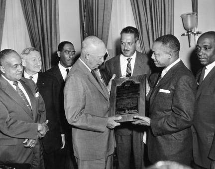 May 5, 1955 - John H. Sengstacke, publisher of the Chicago Defender, presents Dwight D. Eisenhower with the Robert Abbott Award [72-1348-1]
