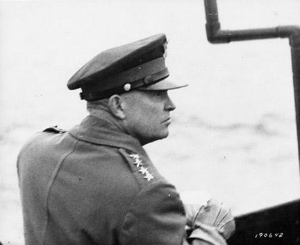 June 7, 1944 - Dwight D. Eisenhower observes air activity from the deck of a warship in the English Channel off the French coast
