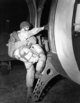 June 6, 1944 - A paratrooper loads for take off in England in preparation to leave for invasion