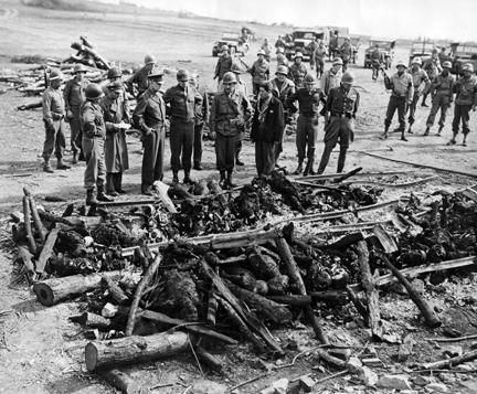 April 12, 1945 - Dwight D. Eisenhower views the charred bodies of prisoners at Ohrdruf