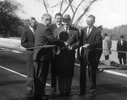 November 3, 1959 - Dwight D. Eisenhower participates in the ribbon cutting ceremony opening the new extension to the George Washington Memorial Parkway. [72-3261-3]