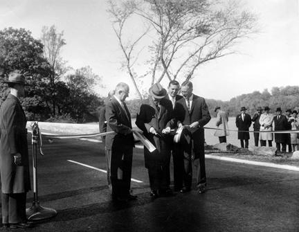 November 3, 1959 - Dwight D. Eisenhower participates in the ribbon cutting ceremony opening the new extension to the George Washington Memorial Parkway. [72-3261-4]