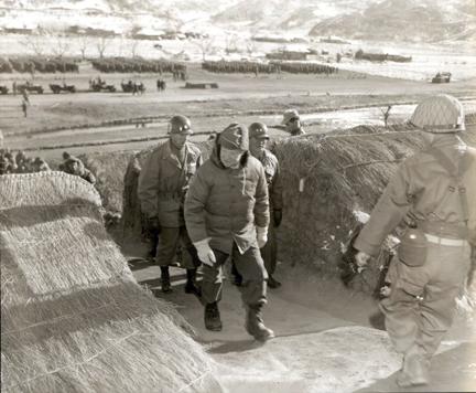 December 4, 1952 - Dwight D. Eisenhower inspects living quarters of troops of the Republic of Korea's Capitol Division during his visit to Division headquarters, Korea. Maj. General Song You Chai, CG, ROK Capitol Division, is at right background [77-18-873]