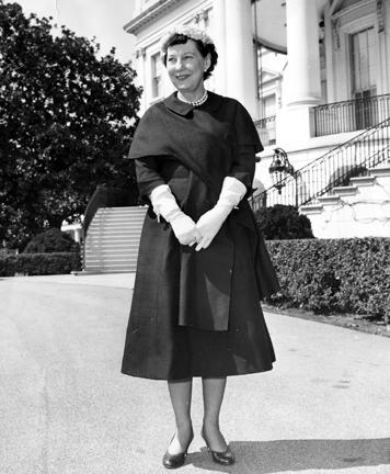 March 22, 1956. Mamie Eisenhower standing outside the White House. [72-1658]