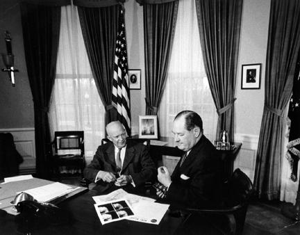 April 1, 1960 - Dwight D. Eisenhower and Dr. T. Keith Glennan review photographs transmitted from Satellite Tiros I. [72-3381-2]