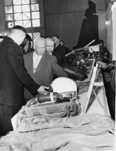 Soviet Premier Nikita Khrushchev and others examine display of U-2 wreckage. [79-5-11]