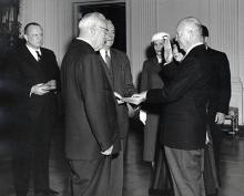 January 20, 1957 - Dwight D. Eisenhower is sworn in by Chief Justice Earl Warren during the private ceremony held in the East Room of the White House