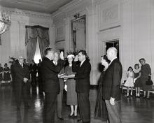 January 20, 1957 - Vice President Richard Nixon being sworn in by Senator William Knowland during the private ceremony held in the East Room of the White House
