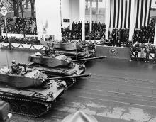 January 21, 1957 - Tanks pass the inaugural parade reviewing stand [72-2063-88]