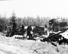 Ardennes-Battle of the Bulge. January 25, 1945 - The 7th Armored Division make ready to move up after having given artillery support to the infantry in their battle for high ground near St. Vith, Belgium. Snow covers the ground.