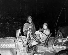 Ardennes-Battle of the Bulge. January 1, 1945 - Major General Maurice Rose (left) confers with Brigadier General Doyle O. Hickey as the column of armor which they are leading is temporarily held up by enemy artillery fire on the outskirts of Floret, Belgium.
