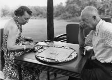 July 30/31, 1954 - Dwight and Mamie Eisenhower relax with a game while vacationing at Camp David