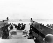 June 1944 - Member of the U.S. Coast Guard participate in the D-Day invasion of the French coast