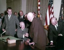 August 21, 1959 - Admitting Hawaii as the 50th state to join the Union. Dwight D. Eisenhower with Fred Seaton, Daniel K. Inouye, Edward Johnson, Sam Rayburn, Richard Nixon, Lt. Col. James S. Cook, Jr., and Maj. Gen. A.T. McNamara. [77-18-1154]