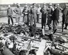 April 12, 1945 - Dwight D. Eisenhower views the charred bodies of prisoners at Ohrdruf