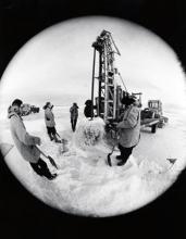 Ross Ice Shelf, Antarctica - An ice drilling rig begins the task of making a hole through the seven foot thick ice in order to set up a fishing site for the scientist of U.S. Antarctic Research Program. The scientist will catch fish in a trap and use them to discover the potentials of fish living in the Antarctic