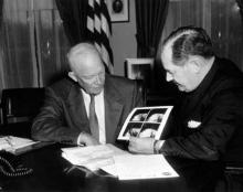 April 1, 1960 - Dwight D. Eisenhower and Dr. T. Keith Glennan review photographs transmitted from Satellite Tiros I. [72-3381-1]